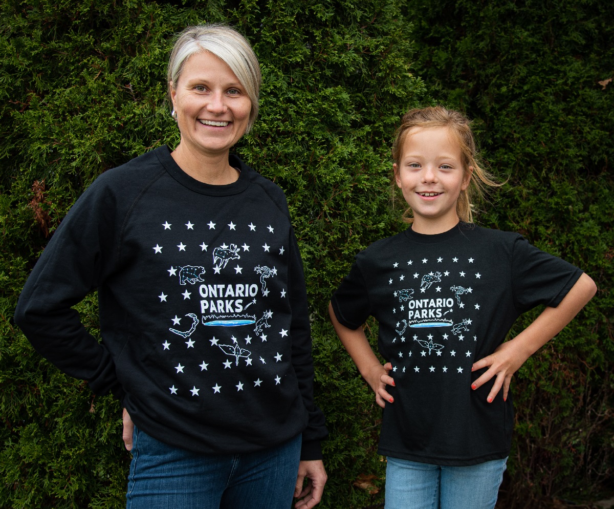 adult and child wearing sweater and t shirt