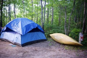 tent and canoe on campsite