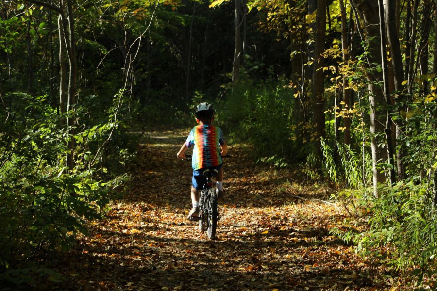 child cycling on Old Farms Trail