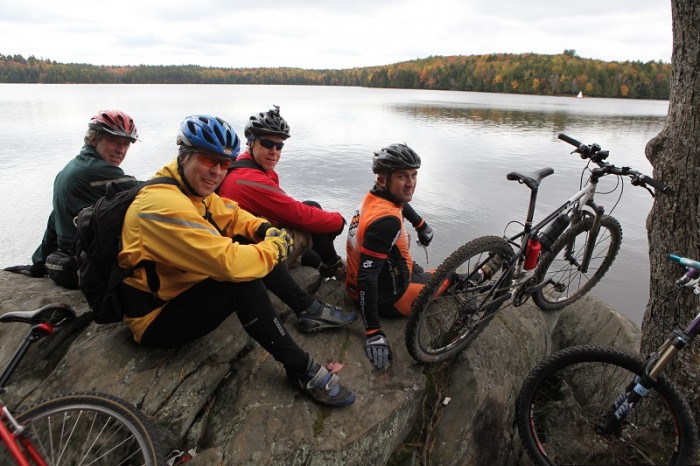 mountain bikers by lake