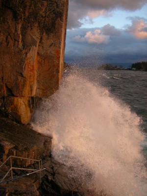 water splashing up side of rockface