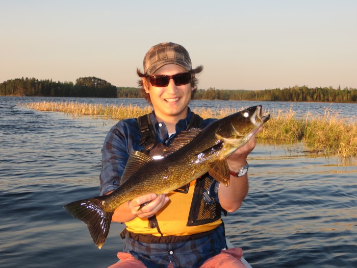 A Quetico canoeist with a walleye