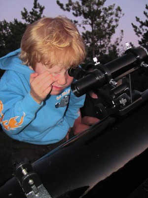 child with telescope