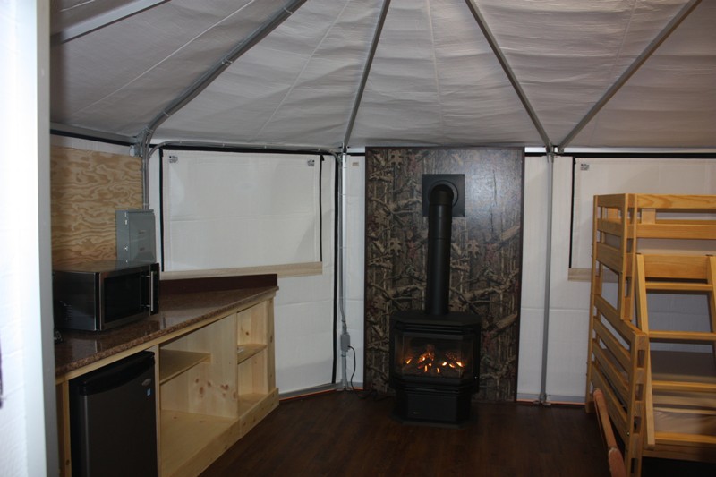 Kitchen and fire place of deluxe yurt