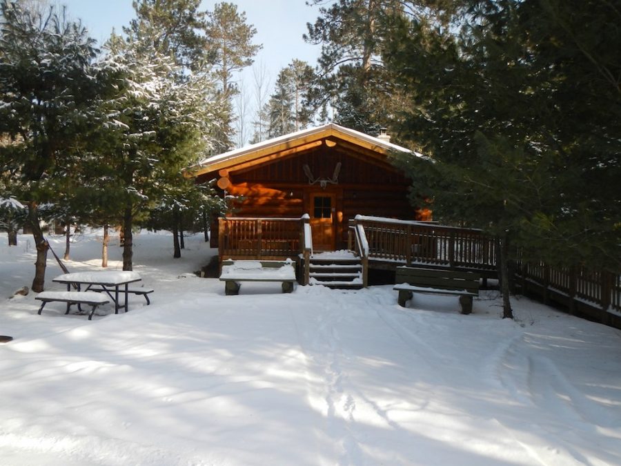 Quetico backcountry cabin in winter -- showing front porch.