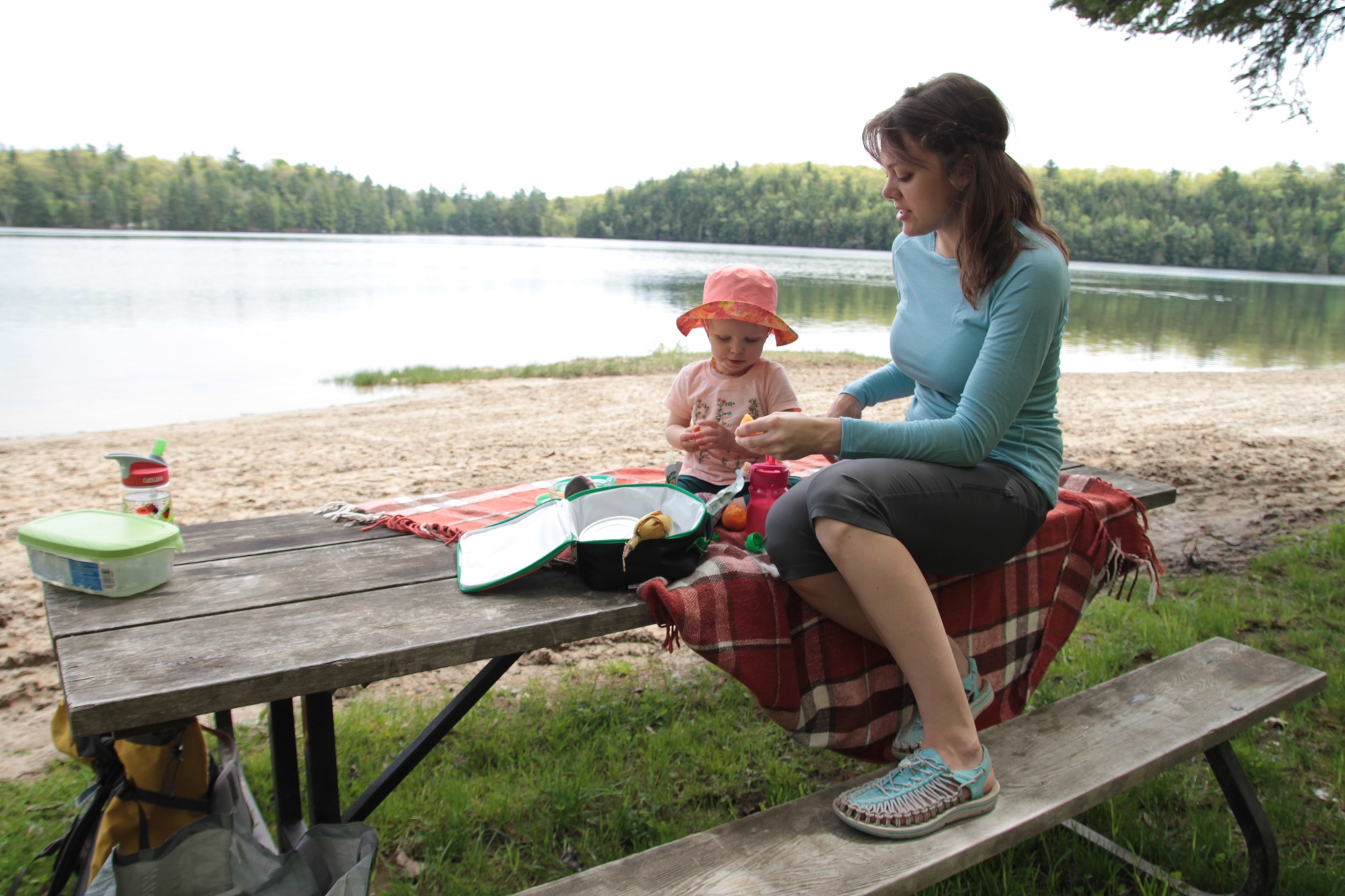 Mother and baby enjoy lakeside picnic at Sharbot Lake