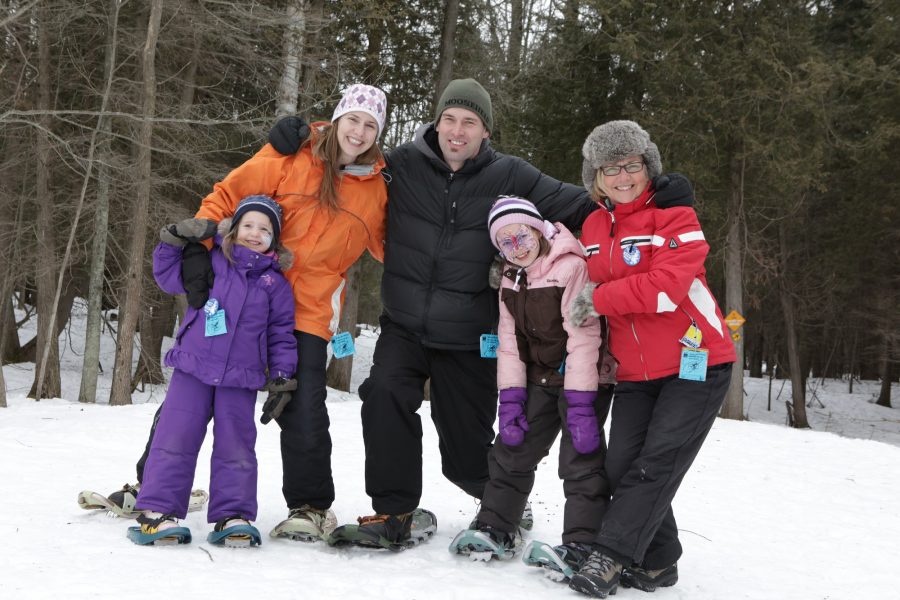family of snowshoers