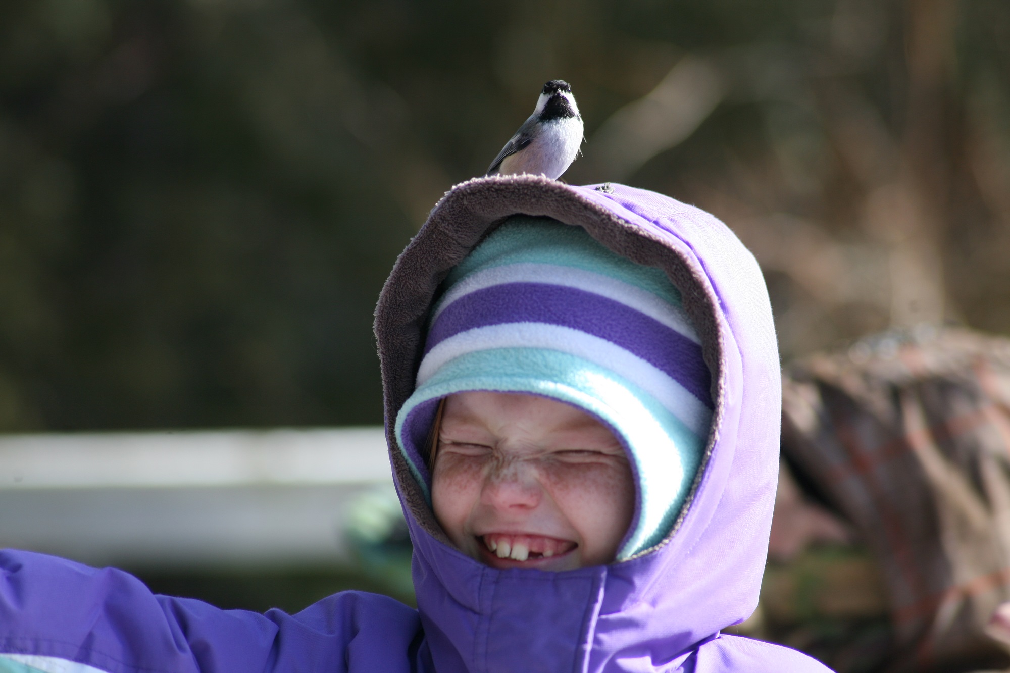 girl with bird on head