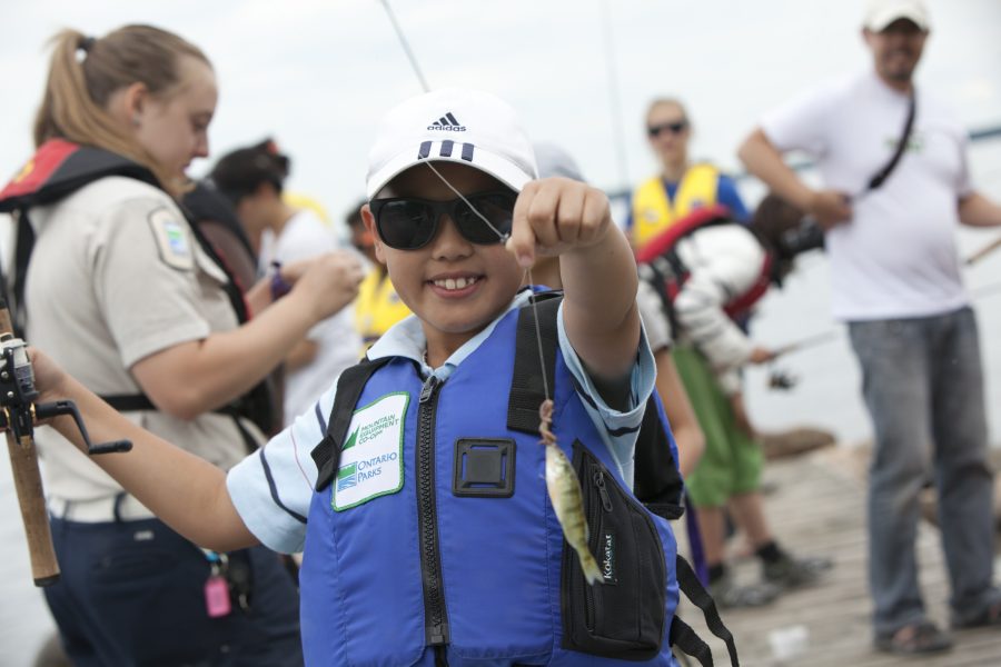 young angler in sunglasses