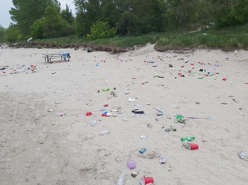 Litter strewn across beach.