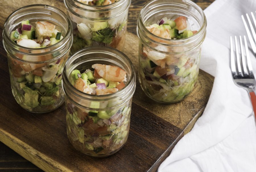 Caesar shrimp ceviche in jars on table