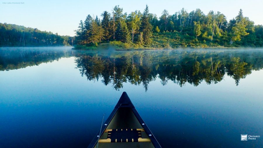 canoe on misty lake