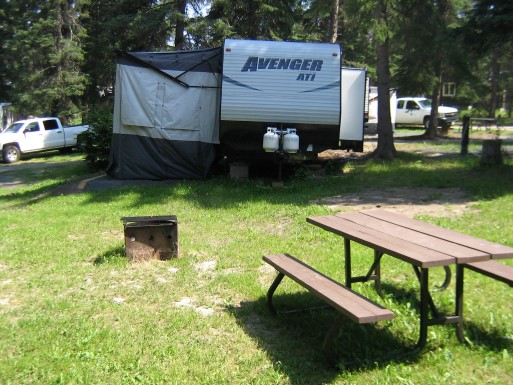 trailer on grassy site at Rushing River