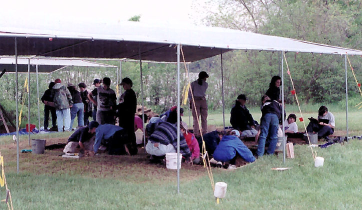people conducting archaeological dig