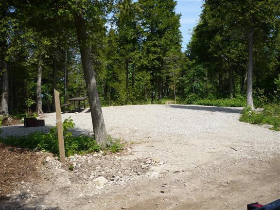 gravel site surrounded by trees