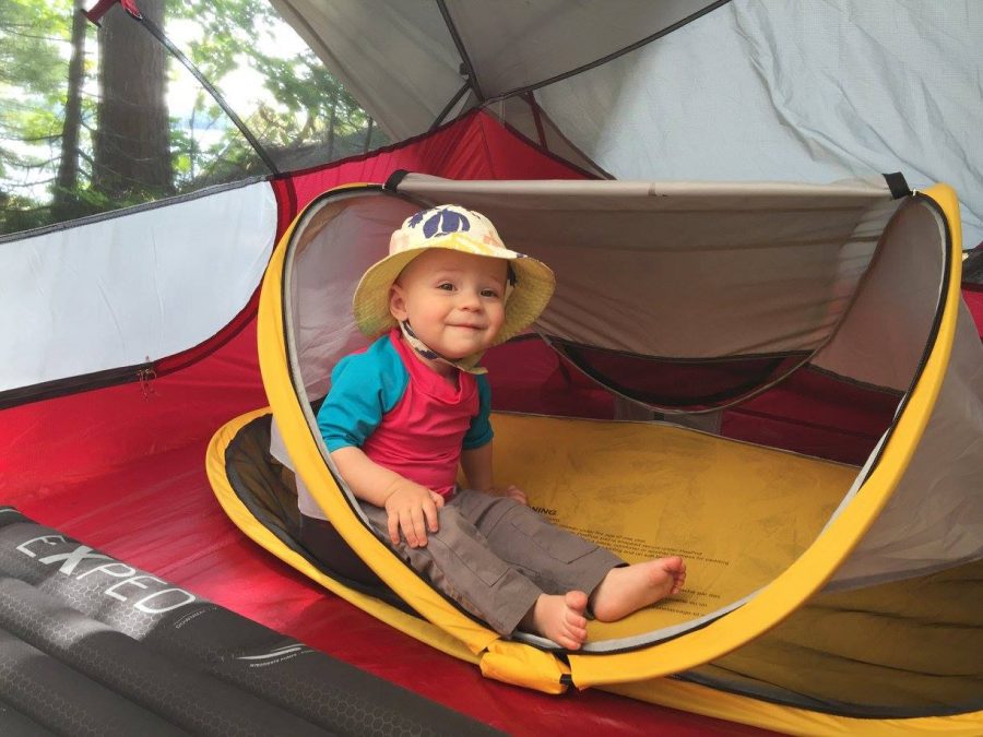 Baby sitting in tent