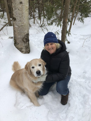 Sandy in snow with dog