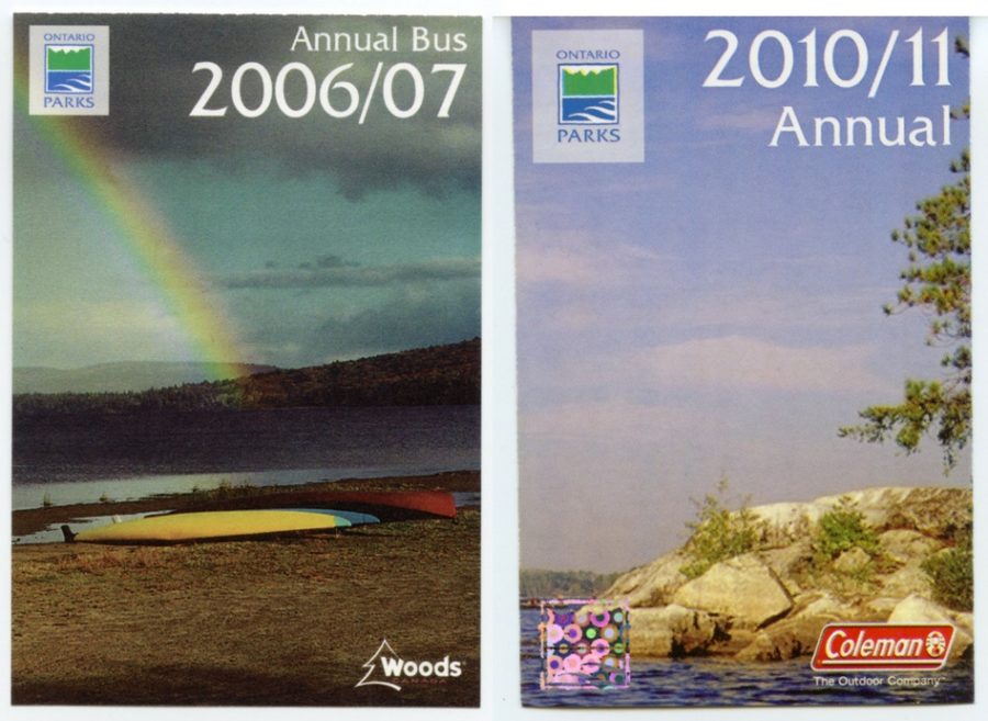 Split image showing two park passes. The first is a picture of 5 or 6 kayaks (all different colours) on a beach with a rainbow in the sky. Shows the Ontario Parks and Woods logo's and text states "Annual Bus 2006/07". The 2nd pass depicts a rocky point jutting out into a blue lake with a blue sky in the background. Pass has Ontario Parks and Coleman logo's as well as a box in the left corner that acts as a placeholder space for a hologram. Text states "2010/11 Annual"