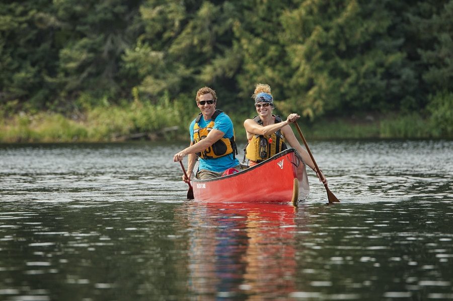 Couple paddling on a lake