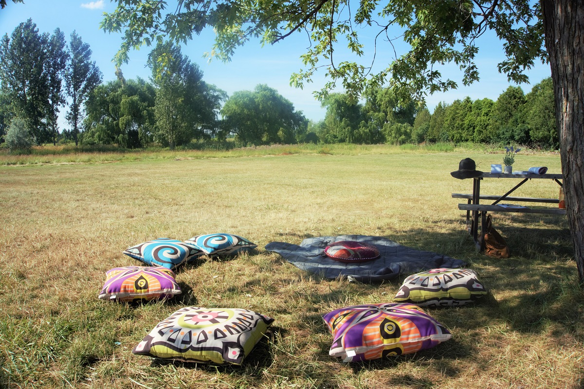 Meditation pillows set out on the grass