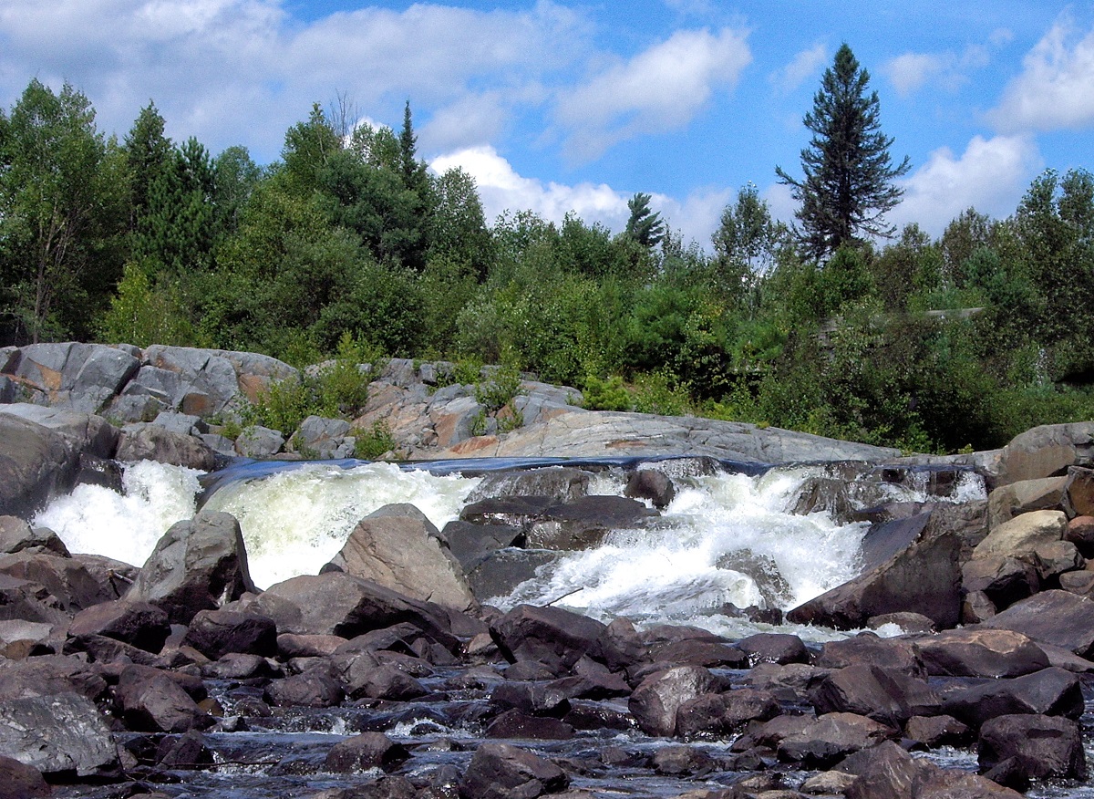 View of waterfalls from below on a blue sky day