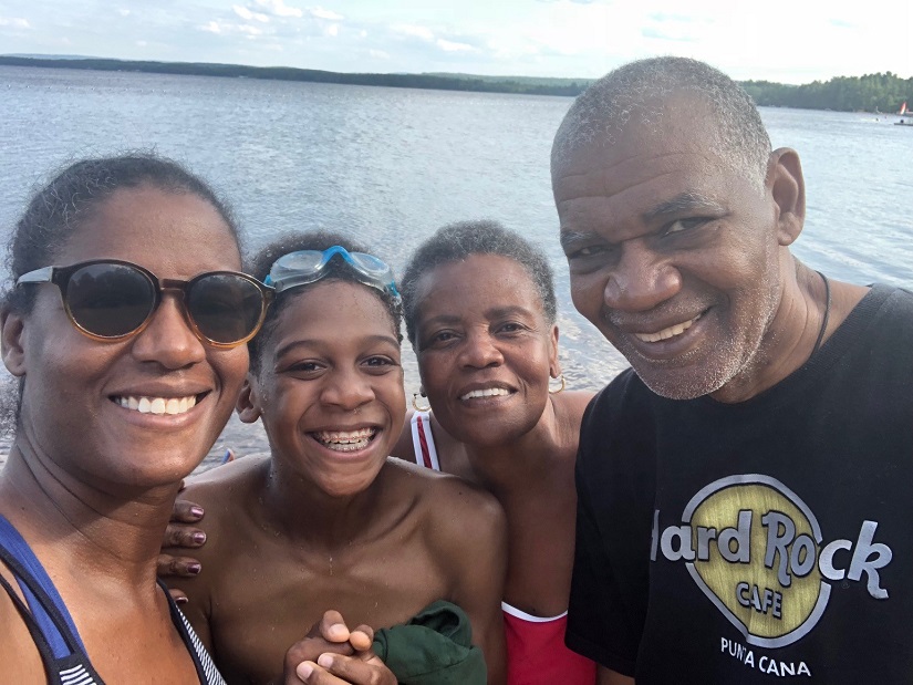Family selfie in front of water
