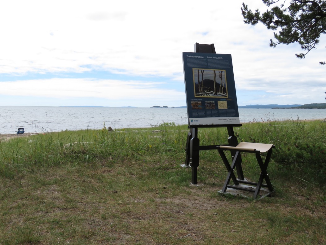 Easel and stool outdoors looking out at the water