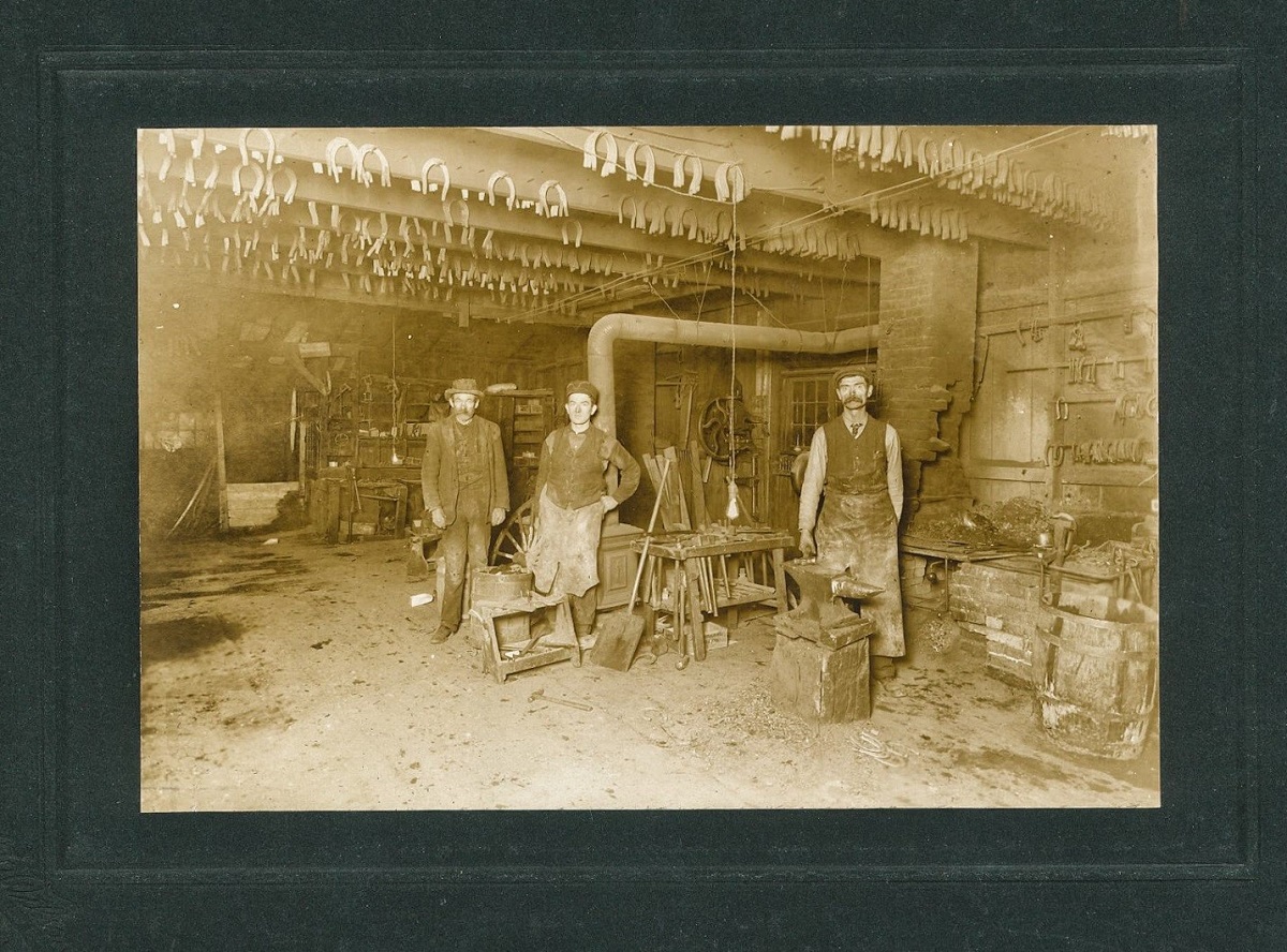 Old timey photo of blacksmith team
