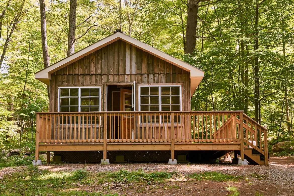 Cabin in the woods with a front deck