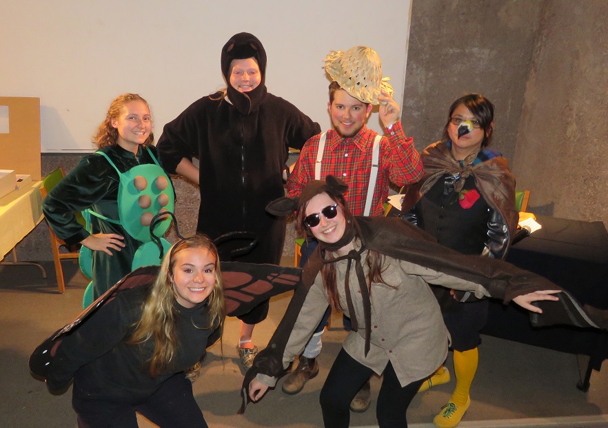 People dressed up in a variety of costumes