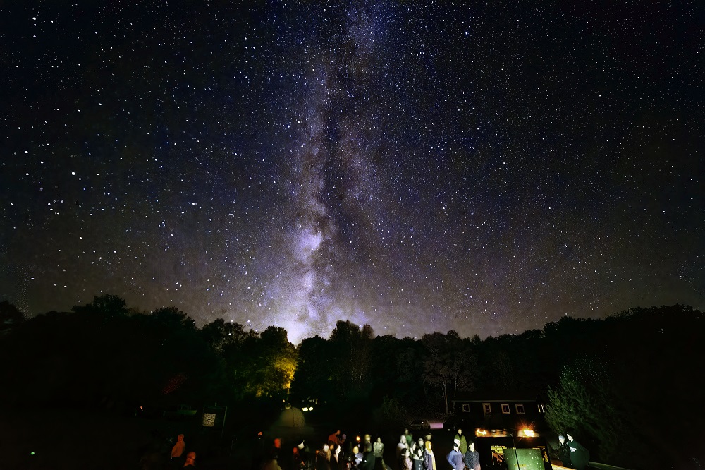 group looking up at stars and milky way