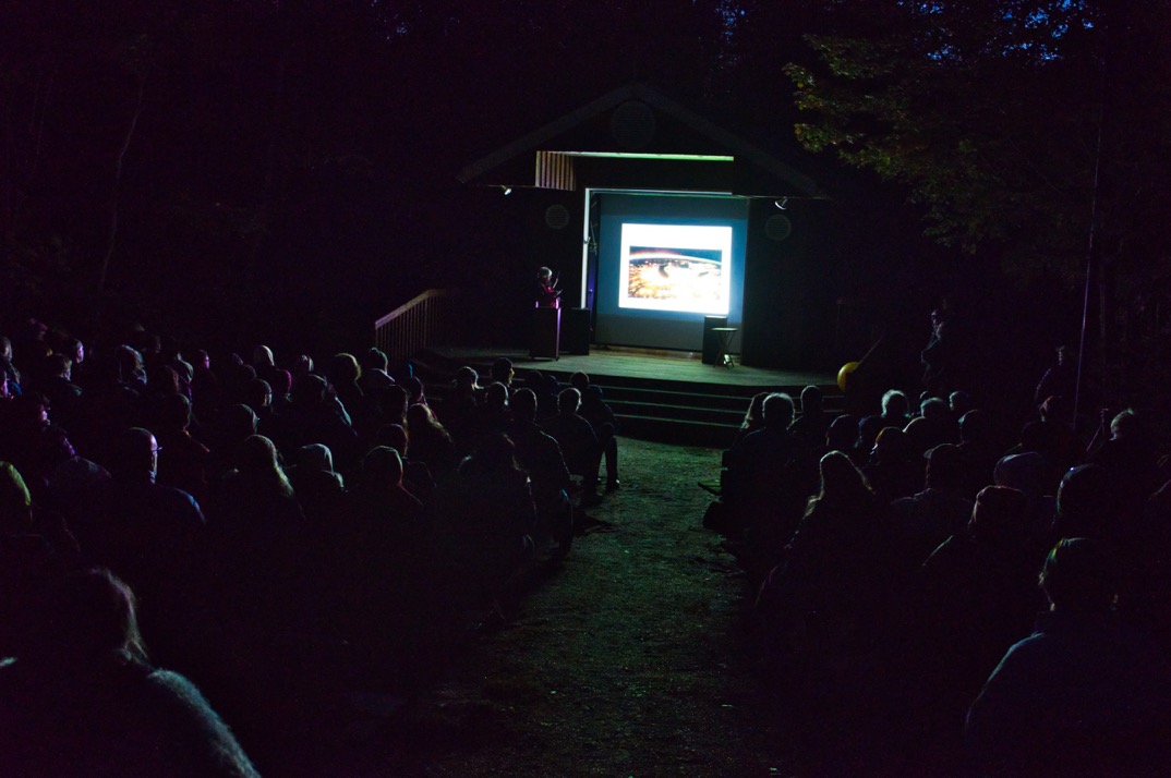 powerpoint presentation delivered at night in park amphitheatre