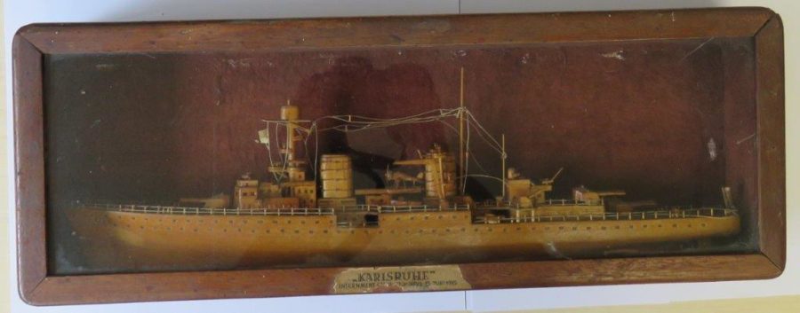 aged model of ship in a wooden shadow box with plaque