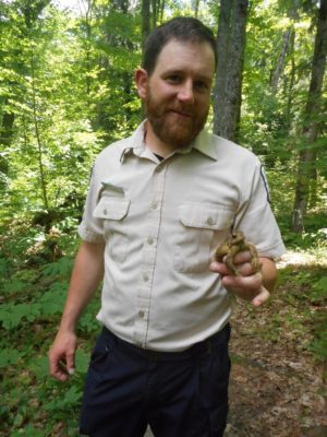 naturalist holding toad