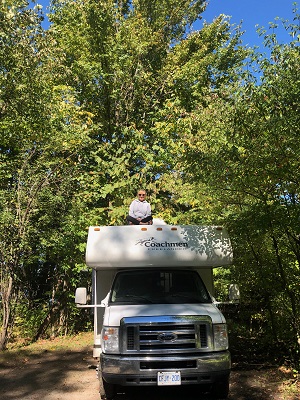 person sitting on top of RV