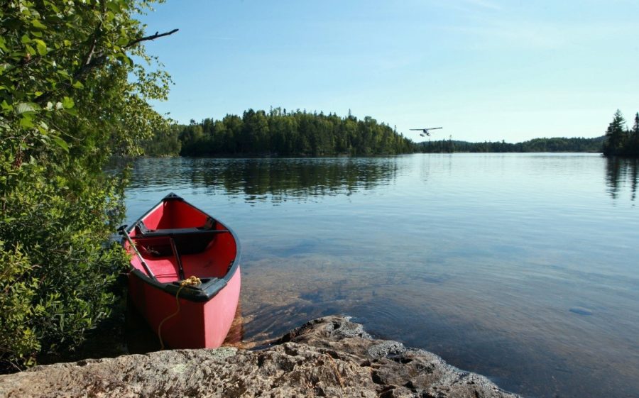A canoe beached upon a rocky outcrop on Temagami lake.