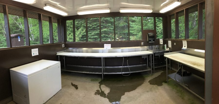 Another view of the fish cleaning building. You can see the two tables and the freezer to store fish left overs to reduce the smell. 