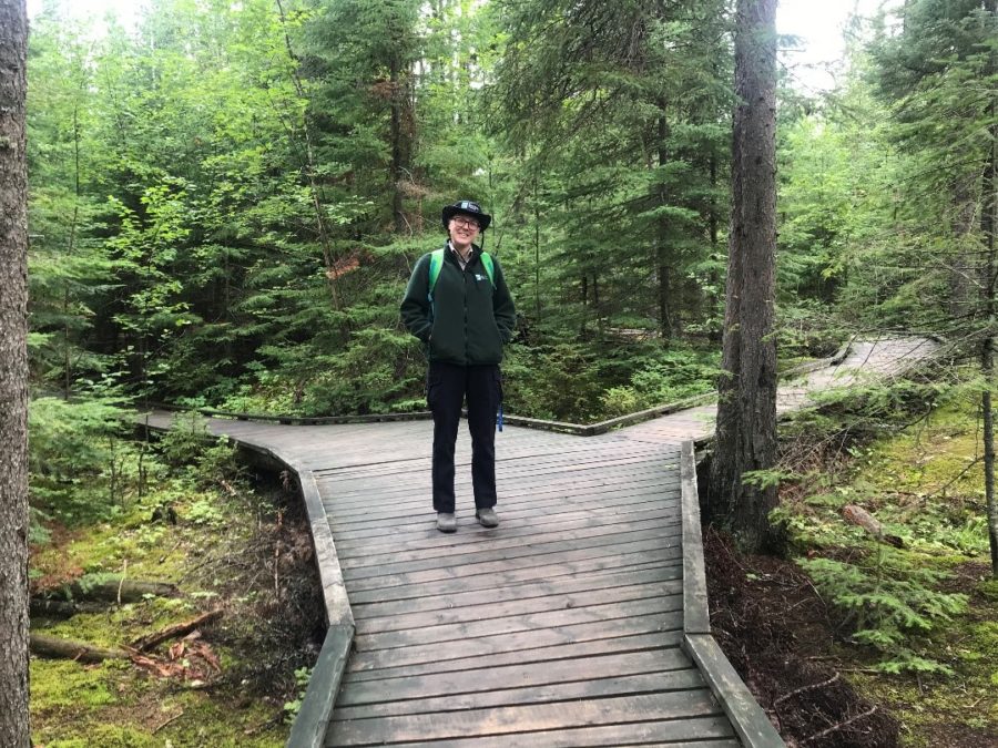Summer standing on a boardwalk at Blue Lake Provincial Park.