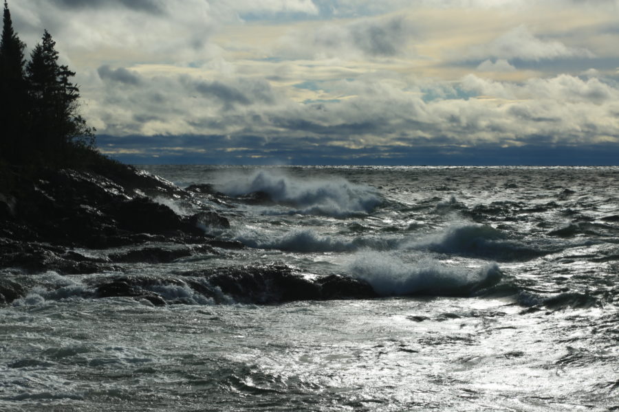 Waves crashing into a rocky shoreline at Lake Superior