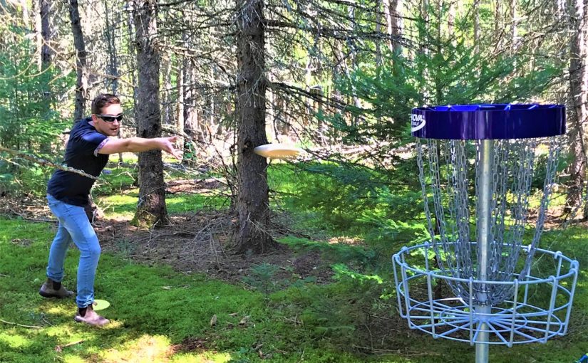 Person playing disc golf.