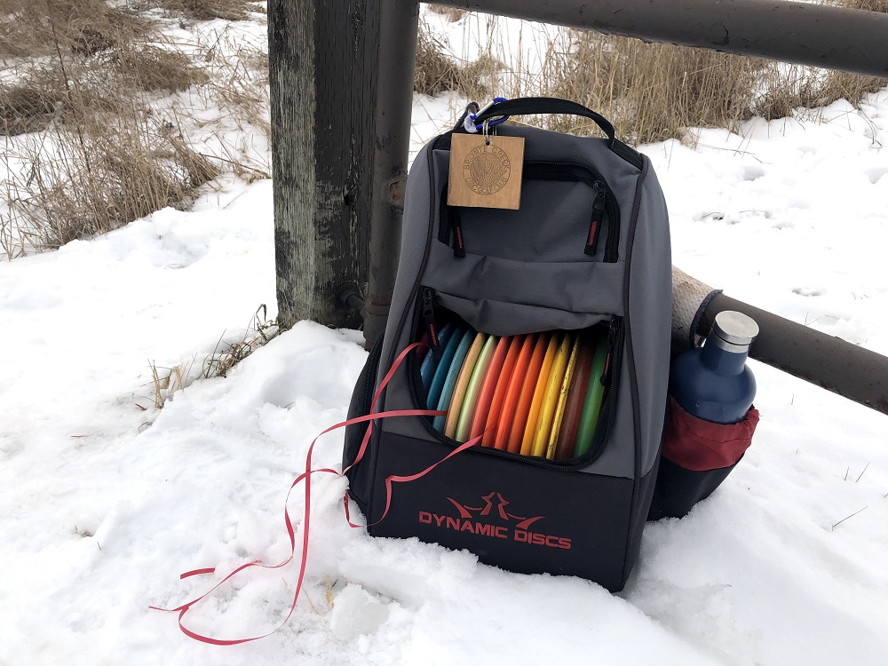 disc golf bag with ribbons taped on discs