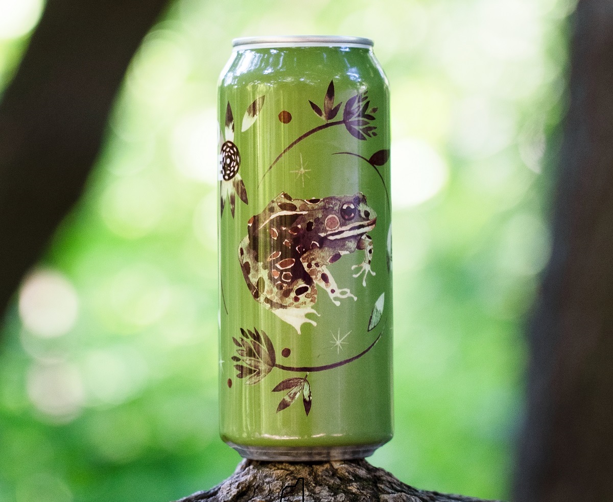 green beer can with artistic rendering of frog and branches