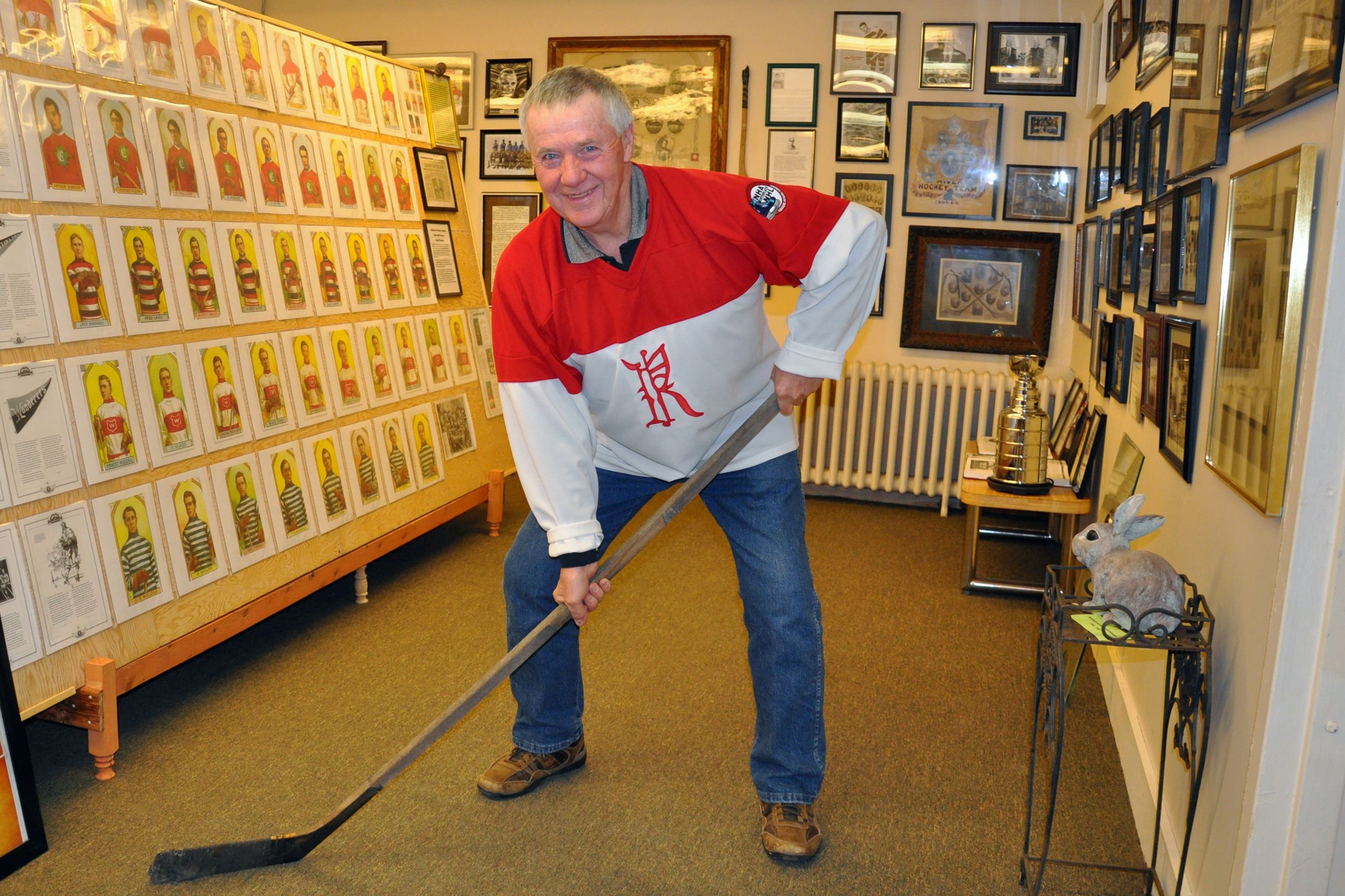 Man with a hockey stick in Renfrew's NHL Museum