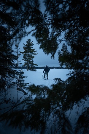 person snowshoeing