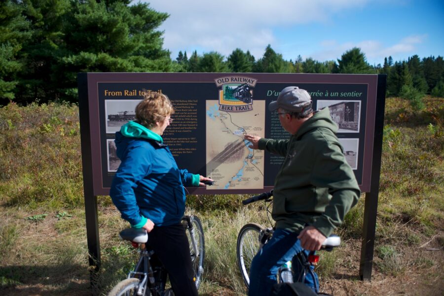 Two cyclists looking at map in Algonquin Park