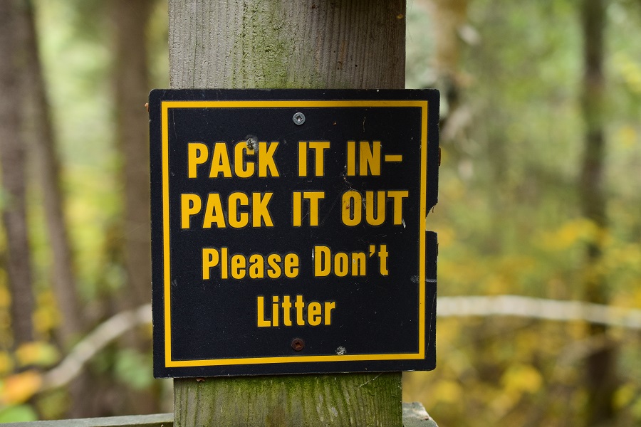 Pack in, pack out trail sign.