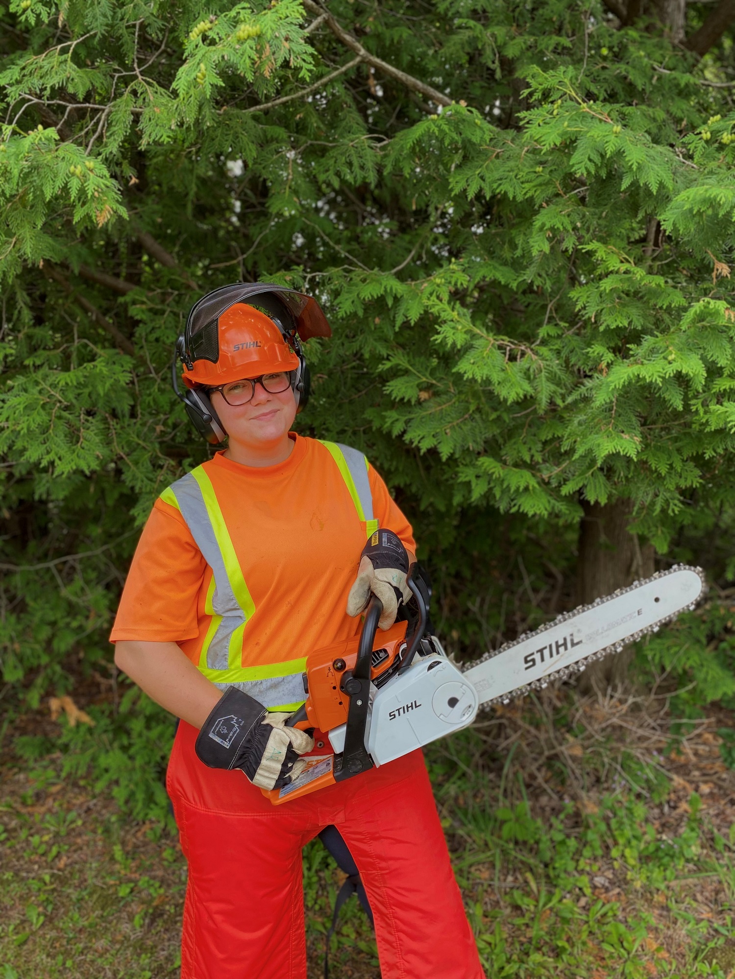 park staff holding chain saw
