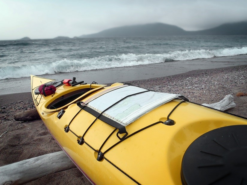 kayak on stormy beach