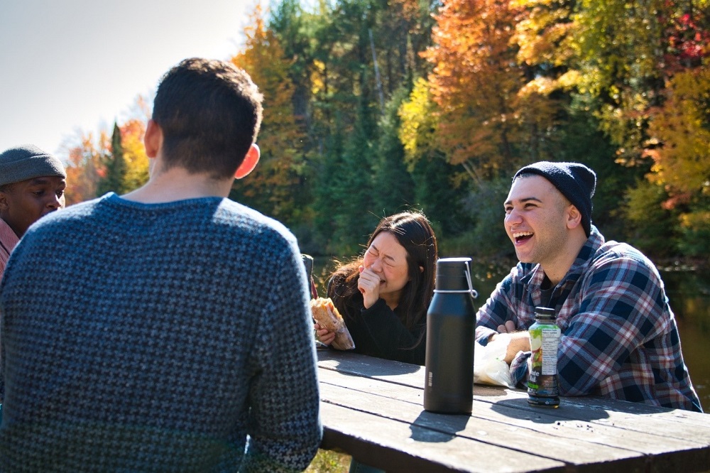 group sitting around picnic table