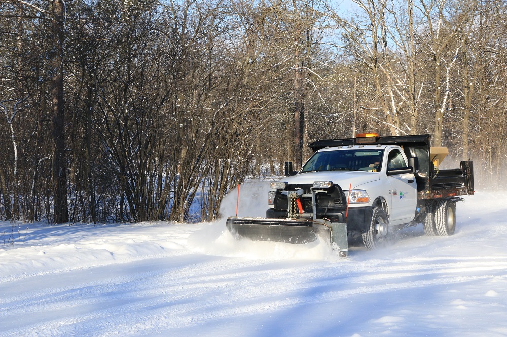 Staff truck plowing snow